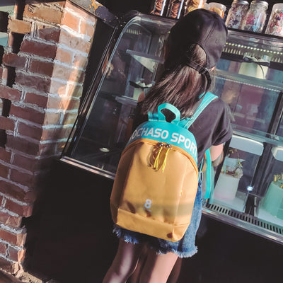 Light blue children's backpack with "TOCHASO SPORTS" text, a number 8, and yellow zipper pulls. - Image 11