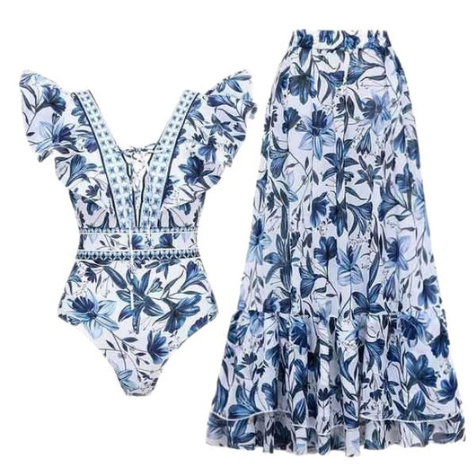 Women's blue and white floral one-piece swimsuit with ruffled V-neck and matching sarong skirt with bow. - Image 5
