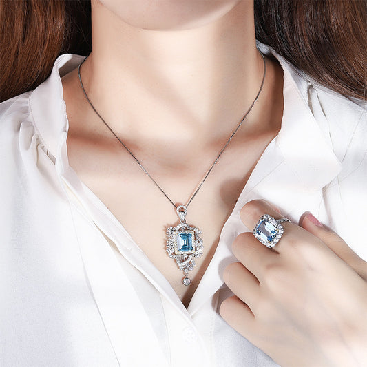 Conjunto de Anillo y Pendiente de Aguamarina Simulada