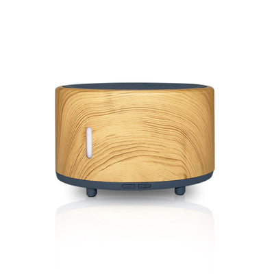Two-tone cylindrical humidifier with a light body and dark base, featuring control buttons and small feet. - Image 7