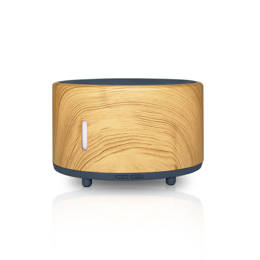 Two-tone cylindrical humidifier with a light body and dark base, featuring control buttons and small feet. - Image 7