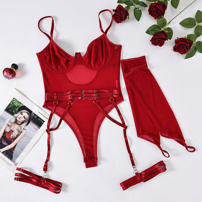 Pink mesh see-through jumpsuit with garter straps and matching arm sleeves, laid flat on a pink background. - Image 7