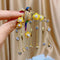 Broche de Lujo con Rama y Borlas