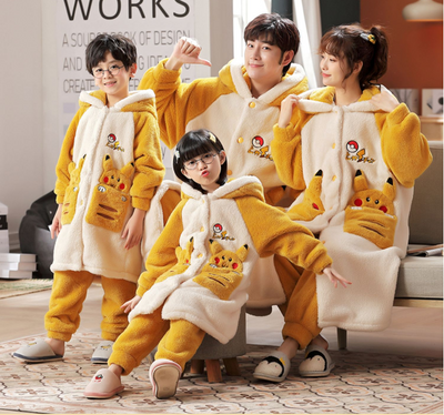 Family of four wearing matching red and cream coral velvet hooded pajamas with embroidered 'money' text and cute pockets. - Image 6