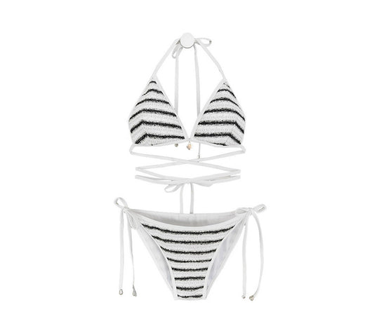 White and black striped bikini with triangle-cut top and tie-side bottom, modeled outdoors. - Image 17