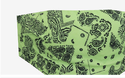Lime green bandana print bandeau bikini top with black low-rise tie-side bottoms on a woman by a pool. - Image 21