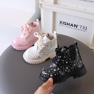 White toddler girls' boots with a holographic star pattern, lace-up front, and side zipper closure.