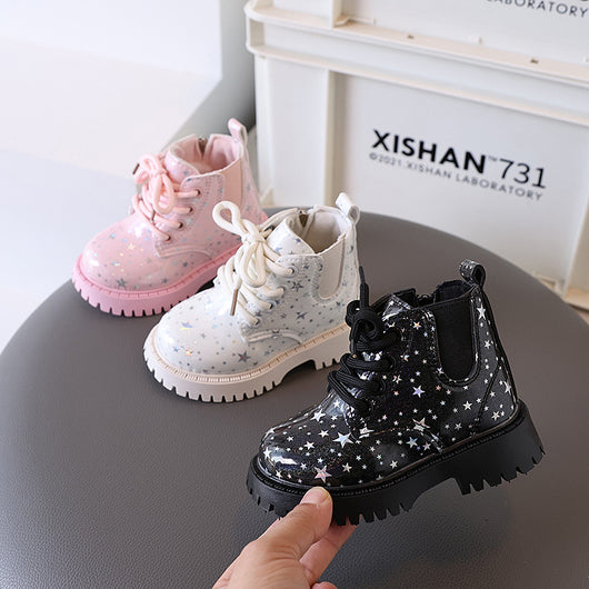 White toddler girls' boots with a holographic star pattern, lace-up front, and side zipper closure.