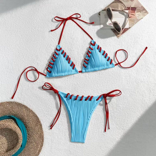 Light blue ribbed bikini swimsuit with pink tie straps and lacing detail, featuring a triangle top and thong bottom. - Image 16