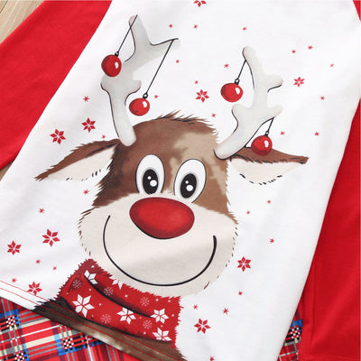 Red and white family Christmas pajamas with a reindeer graphic on the tops and red plaid pants, including a baby romper and hat. - Image 4