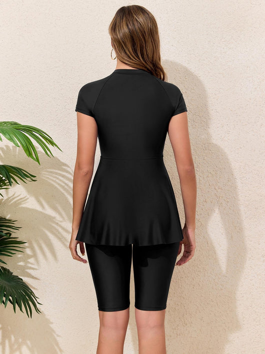 Navy blue two-piece conservative swimwear with short-sleeve peplum top and mid-length shorts, featuring a front zipper. - Image 14