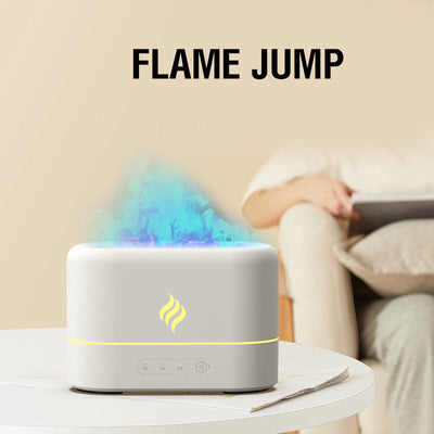 White simulated flame humidifier with blue light effect and yellow flame icon, sitting on a white table. - Image 12