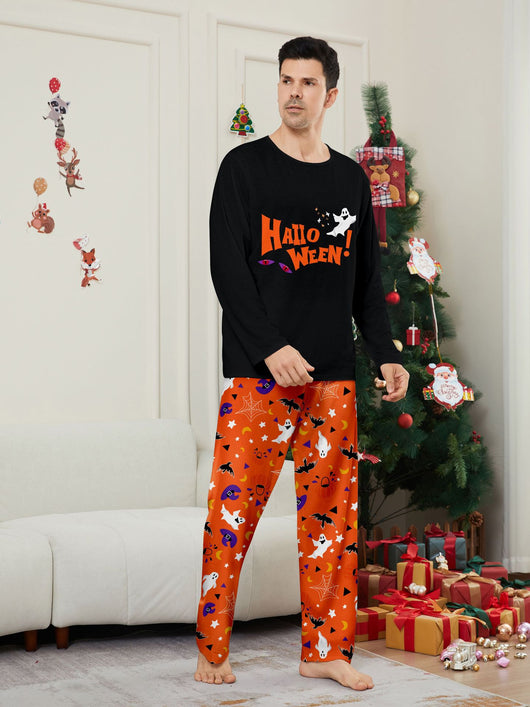 Family of four wearing matching black and orange Halloween long-sleeve pajamas with ghost and bat prints. - Image 9