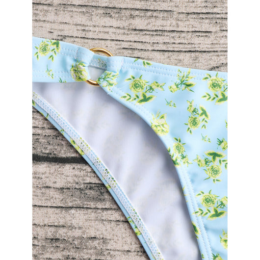 Woman smiling in a white bikini with blue floral print, triangle top, and briefs bottoms, on a sunny beach. - Image 38