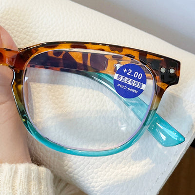 Women's retro leopard print presbyopic glasses with anti-blue light clear lenses and a blue gradient bottom frame. - Image 4