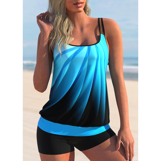 Plus size black tankini top with vibrant pink and blue butterfly print, paired with black swim shorts, on a beach. - Image 10