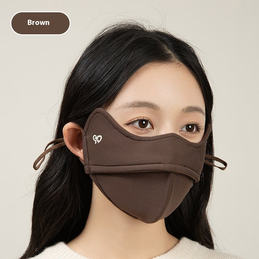 Woman wearing a grey outdoor cycling wind mask with ear hooks and a small heart logo, designed for cold-proof eye protection. - Image 8