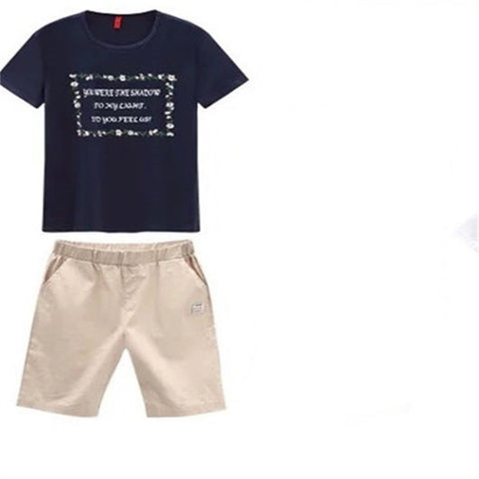 Navy blue short-sleeve t-shirt with a white floral-framed text print paired with light beige elastic-waist shorts. - Image 9