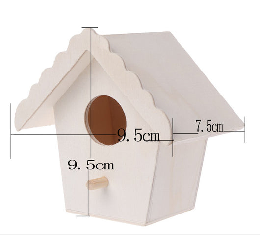Unfinished wooden birdhouse with a circular entrance hole and a small perch, held by a hand. - Image 5
