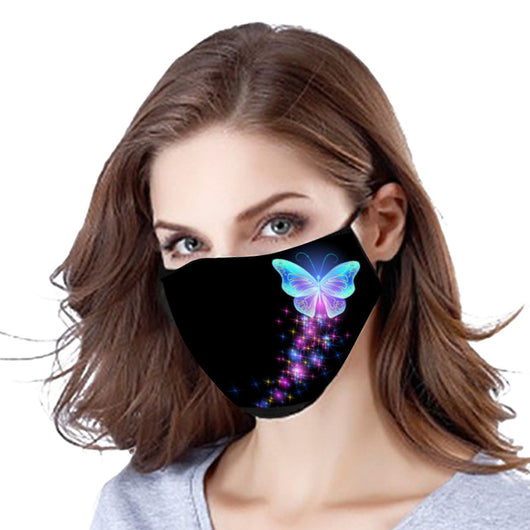 Black cotton face mask with a glowing pink butterfly and blue abstract pattern, worn by a woman.