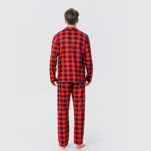 Baby in a red and black buffalo plaid long-sleeve pajama romper, viewed from the back with arms raised. - Image 28