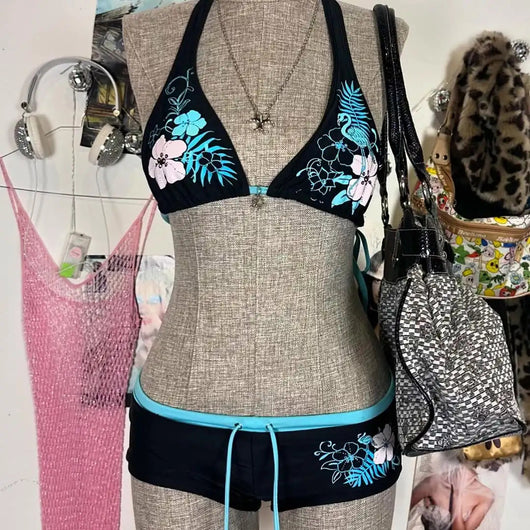 Black halter bikini suit with boy short bottoms, featuring pink and blue floral and flamingo patterns. - Image 8