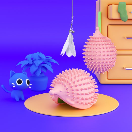 Lime green hedgehog-shaped cat toy with soft spikes, next to its matching green packaging box.