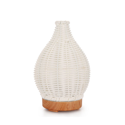 Mini ultrasonic aroma diffuser with a brown hollow rattan-style body and a white base, featuring control buttons. - Image 8