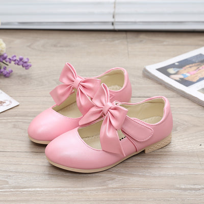 Gold Mary Jane shoes for girls with a large decorative bow on the strap and a low, comfortable heel. - Image 10