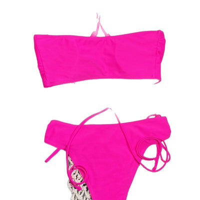 Neon pink lace-up bikini with a bandeau top and high-cut bottom, laid flat on a split gray and white background. - Image 5