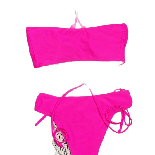 Neon pink lace-up bikini with a bandeau top and high-cut bottom, laid flat on a split gray and white background. - Image 5