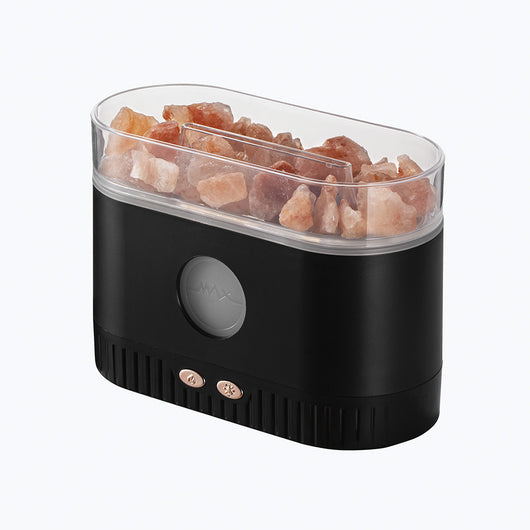 Black desktop humidifier with clear top filled with pink Himalayan salt rocks and rose gold control buttons. - Image 4