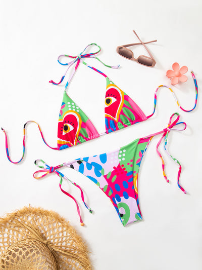 Women's vibrant abstract eye print bikini with triangle top and tie-side bottoms, featuring pink, green, and blue. - Image 9