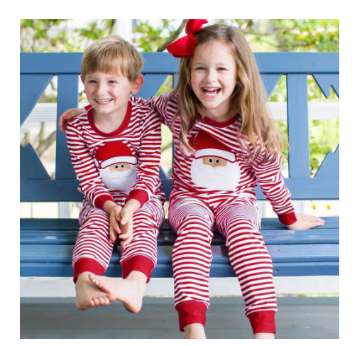 Red and white Christmas pajama set with a long-sleeve top featuring 'Merry Christmas' text and reindeer antlers, paired with striped pants.