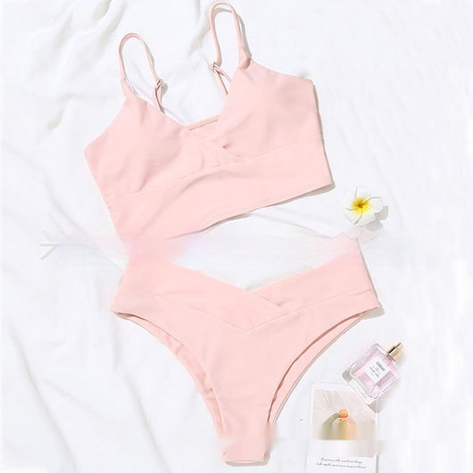 Bright yellow two-piece bikini swimsuit with a crop top and high-cut V-front bottoms, laid flat. - Image 18