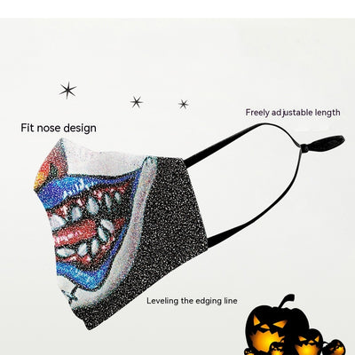 Dark green dust mask with a pattern of white skulls, blue flowers, and pink butterflies, featuring black ear loops. - Image 2