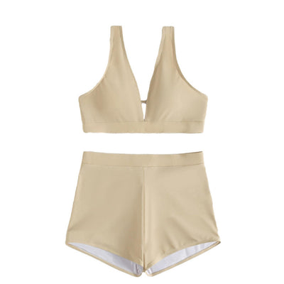 Women's deep-V Halong Bay-style two-piece swimsuit in light beige, featuring a crop top and high-waisted shorts. - Image 5