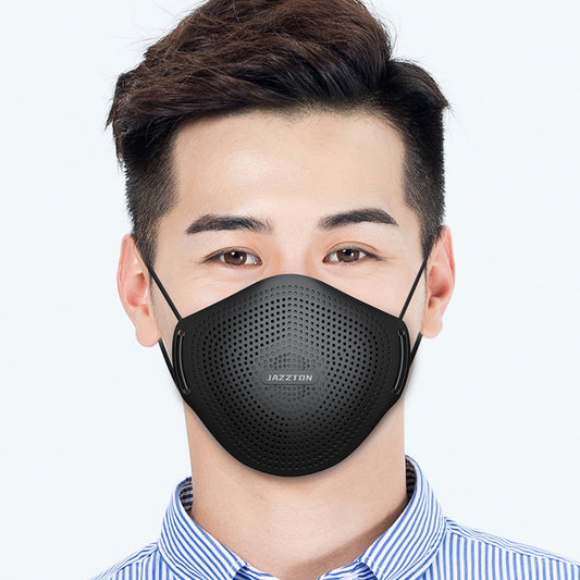 Light blue dust mask with perforated design and central breathing valve, worn by a woman.