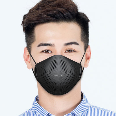 Light blue dust mask with perforated design and central breathing valve, worn by a woman.