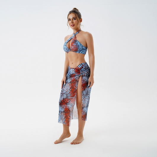Women's plus size split swimsuit with a blue and green tropical leaf print halter bikini top and matching sarong skirt. - Image 15