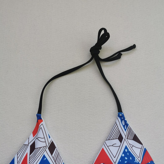 Red, white, and blue geometric print bikini with a triangle top and high-waisted, high-cut bottom. - Image 22