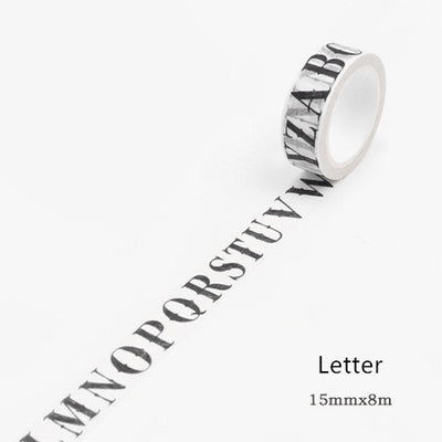 Washi tape with a black gothic-style alphabet letter pattern on a white background, showing a partial alphabet.