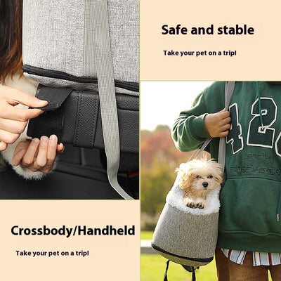 Grey pet car seat with plush white lining, designed for small dogs or cats, placed on a car's center console. - Image 3
