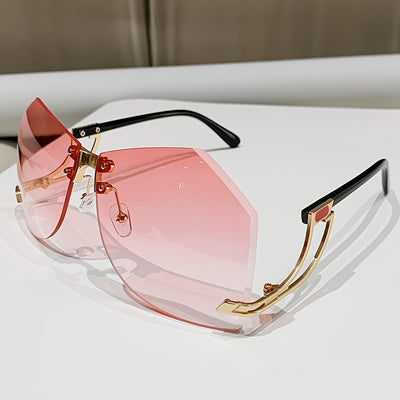 Rimless sunglasses with gradient pink lenses and gold-tone hollow temples, featuring a unique quadrilateral shape. - Image 6