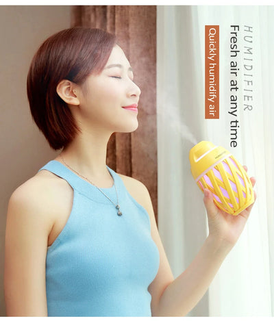Light green football-shaped humidifier with a decorative lattice pattern and a power button on top. - Image 8