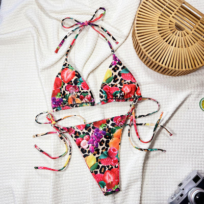 Women's separated bikini with a vibrant fruit and leopard print, featuring a halter-neck top and tie-side bottom. - Image 5