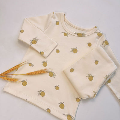 Light yellow infant long-sleeved pajama set with milk bottle and cookie print, suitable for homewear. - Image 6