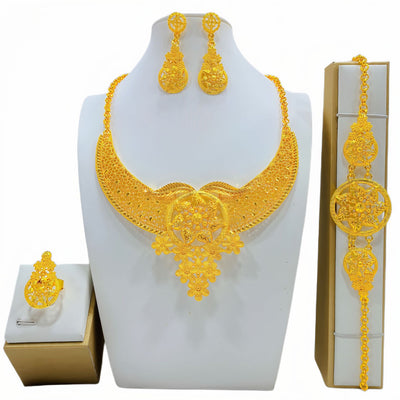 Gold-colored women's jewelry set with ornate floral and filigree designs, including a necklace, drop earrings, bracelet, and ring. - Image 10