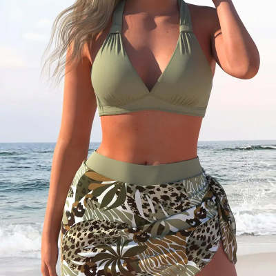 Women's olive green halter push-up bikini top with a matching tropical and leopard print sarong skirt on a beach. - Image 9