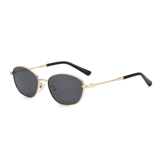 Small oval metal sunglasses for women with a gold frame and brown gradient lenses, featuring black temple tips. - Image 3